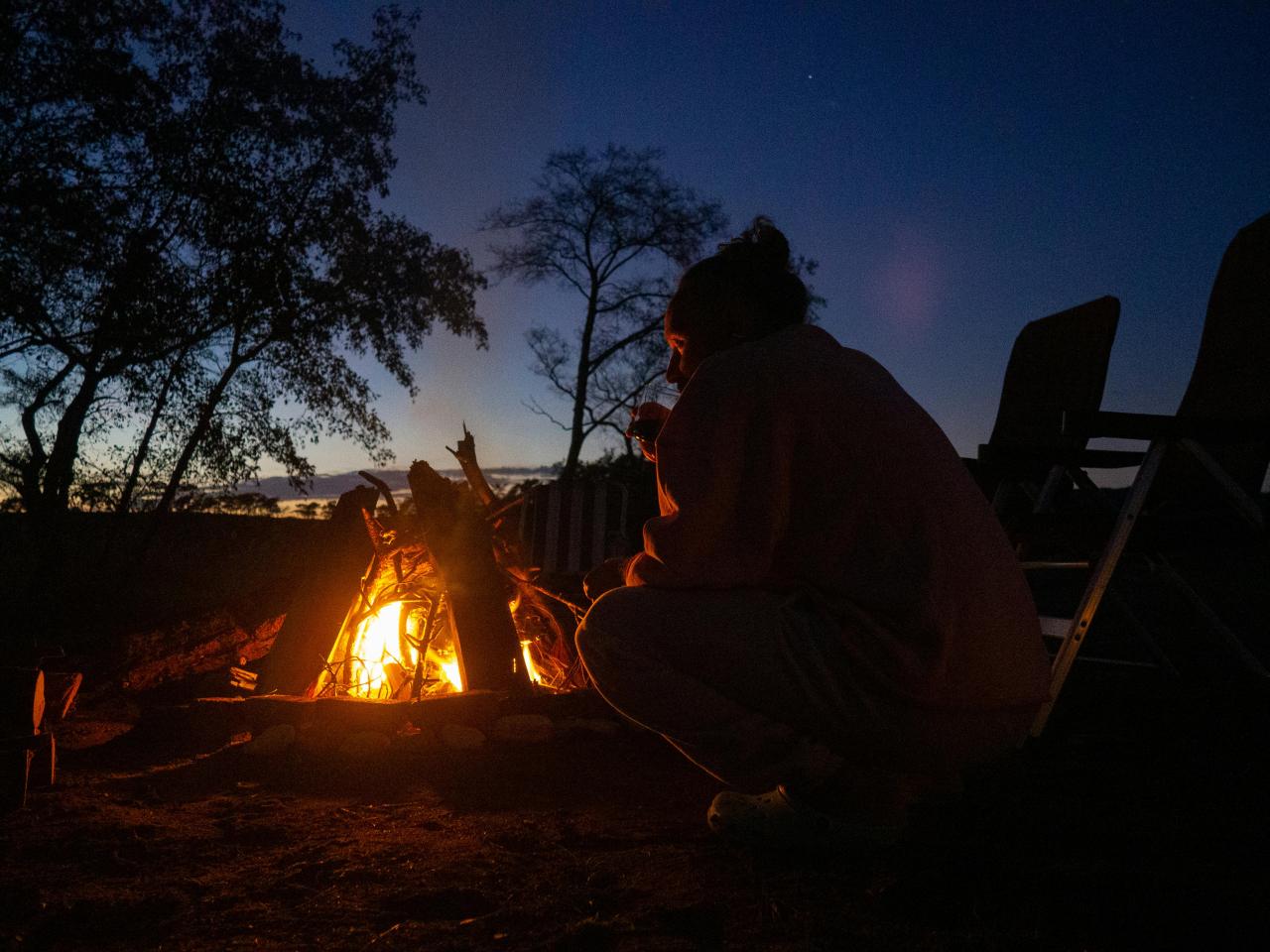 family outdoor camping fire gathering evening