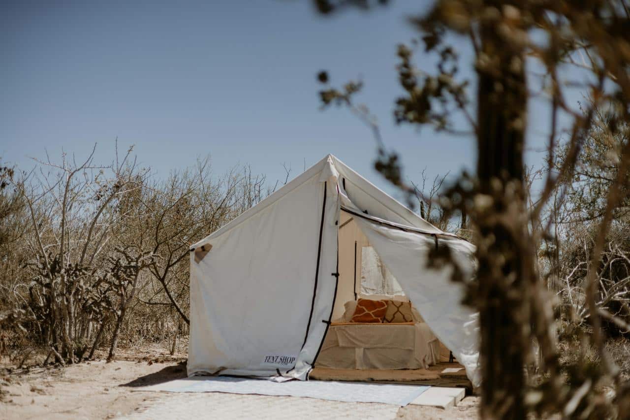 family enjoying outdoor glamping setup