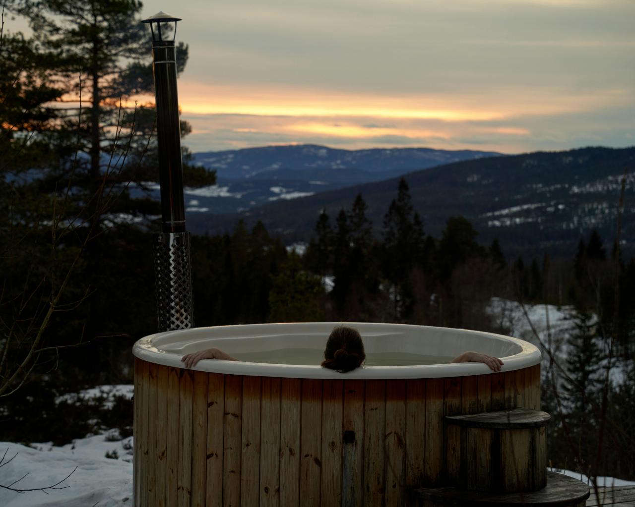 couple relaxing in hot tub under stars