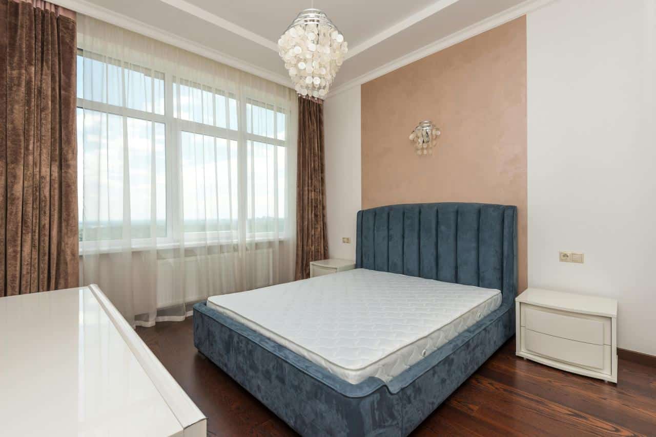 modern cozy bedroom with large window