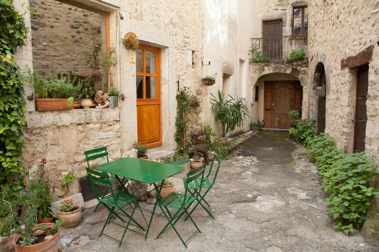 rustic french gite with stone walls and terrace